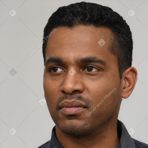 Neutral latino young-adult male with short  black hair and brown eyes