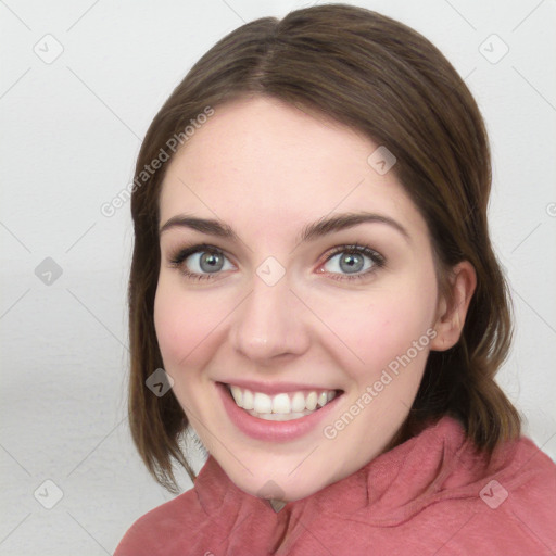 Joyful white young-adult female with medium  brown hair and blue eyes