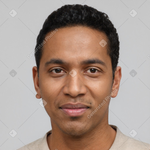 Joyful black young-adult male with short  black hair and brown eyes