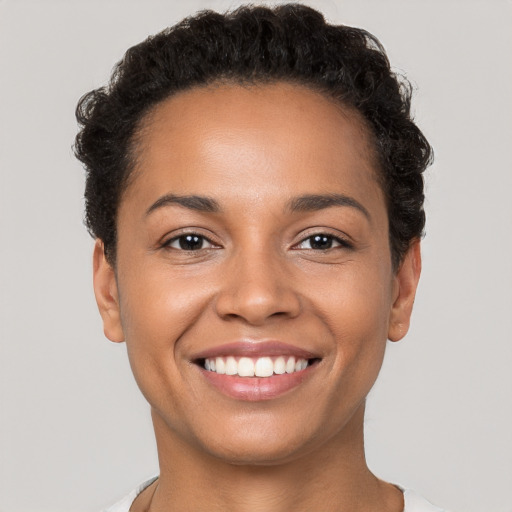 Joyful white young-adult female with short  brown hair and brown eyes