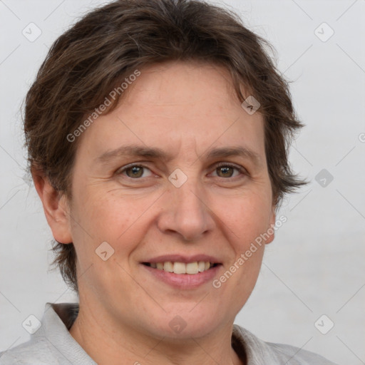 Joyful white adult female with short  brown hair and brown eyes