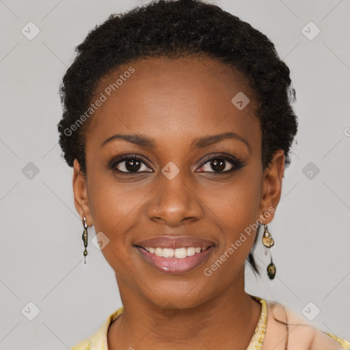 Joyful black young-adult female with short  brown hair and brown eyes