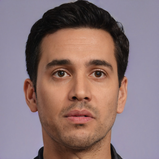Neutral white young-adult male with short  black hair and brown eyes