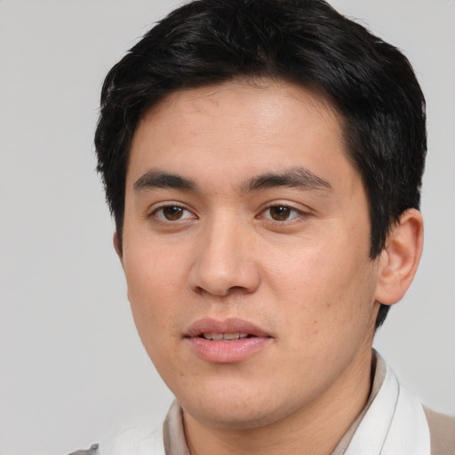 Joyful white young-adult male with short  black hair and brown eyes