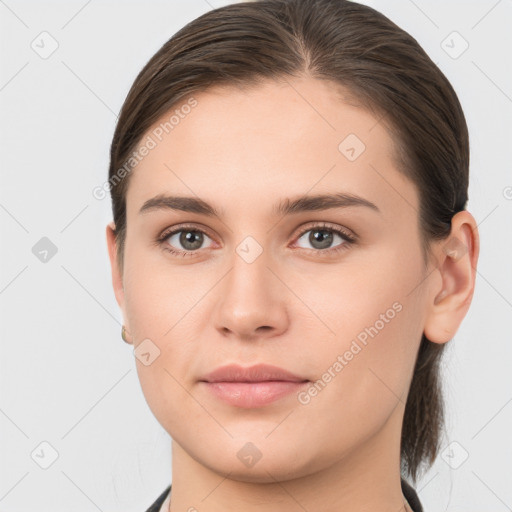 Neutral white young-adult female with medium  brown hair and brown eyes