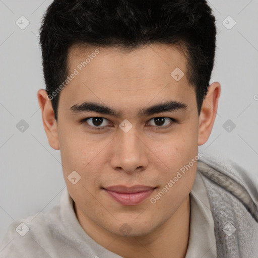 Joyful asian young-adult male with short  brown hair and brown eyes