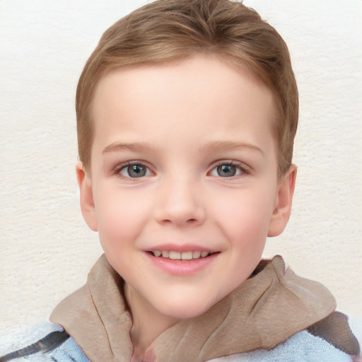 Joyful white child female with short  brown hair and blue eyes