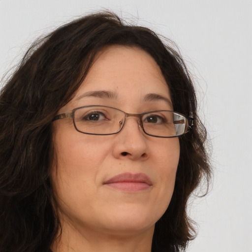 Joyful white adult female with long  brown hair and brown eyes