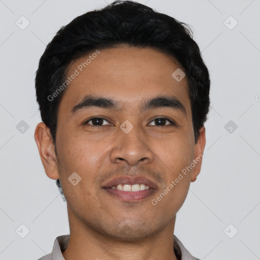 Joyful latino young-adult male with short  black hair and brown eyes