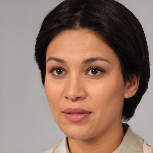 Joyful white young-adult female with medium  brown hair and brown eyes
