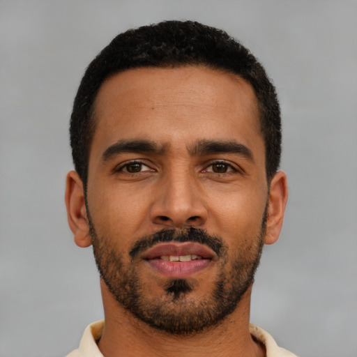 Neutral latino young-adult male with short  black hair and brown eyes