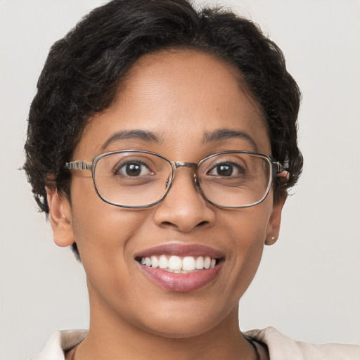 Joyful white adult female with short  brown hair and brown eyes