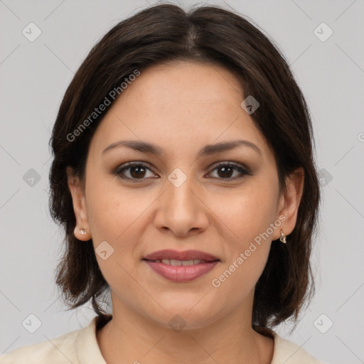 Joyful latino young-adult female with medium  brown hair and brown eyes