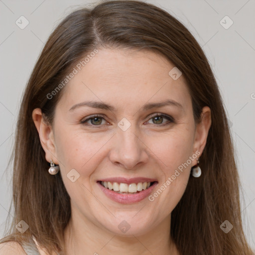 Joyful white adult female with long  brown hair and grey eyes