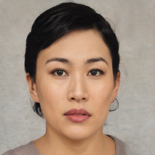 Neutral asian young-adult female with medium  black hair and brown eyes