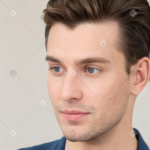 Neutral white young-adult male with short  brown hair and grey eyes