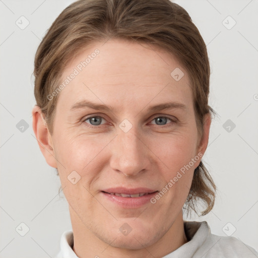 Joyful white young-adult female with short  brown hair and grey eyes