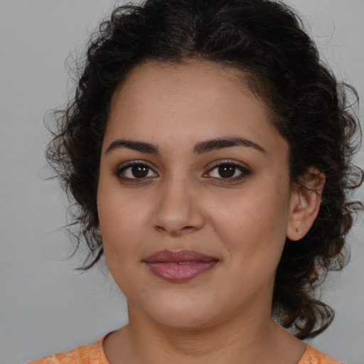 Joyful white young-adult female with medium  brown hair and brown eyes