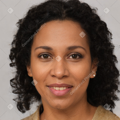 Joyful black adult female with medium  brown hair and brown eyes