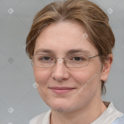 Joyful white adult female with medium  brown hair and blue eyes