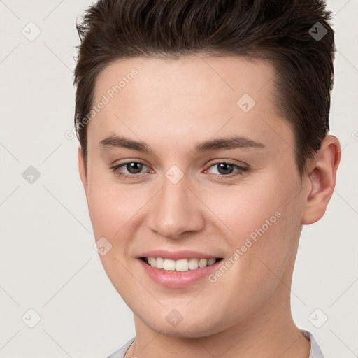 Joyful white young-adult female with short  brown hair and brown eyes