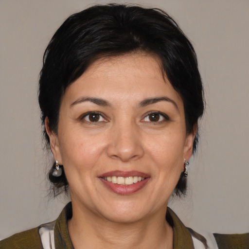 Joyful white adult female with medium  brown hair and brown eyes