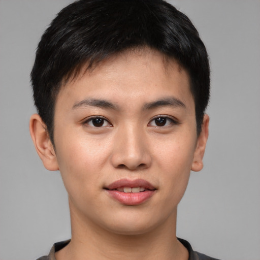 Joyful asian young-adult male with short  brown hair and brown eyes