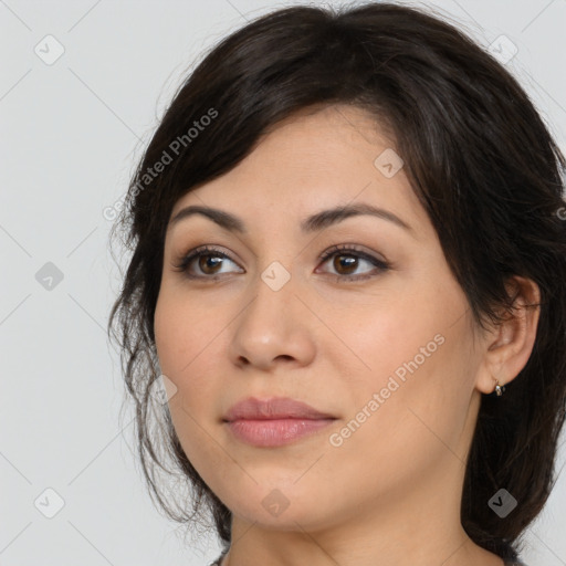 Joyful latino young-adult female with long  brown hair and brown eyes