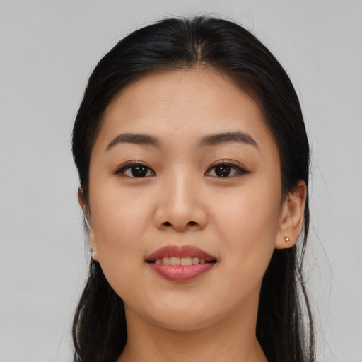 Joyful asian young-adult female with long  black hair and brown eyes