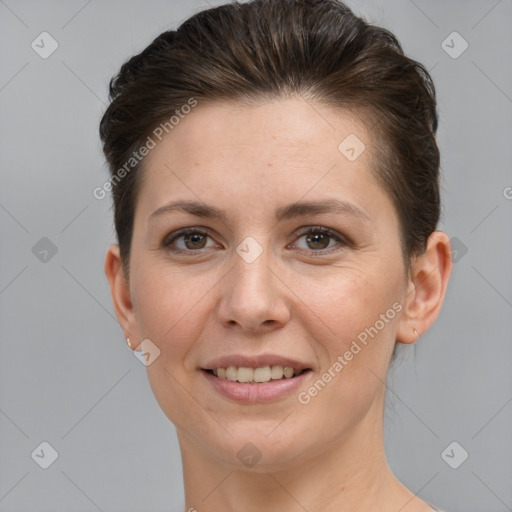 Joyful white young-adult female with short  brown hair and grey eyes