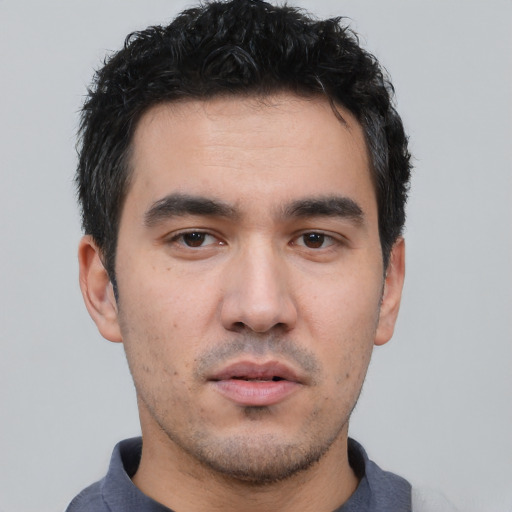 Neutral white young-adult male with short  black hair and brown eyes