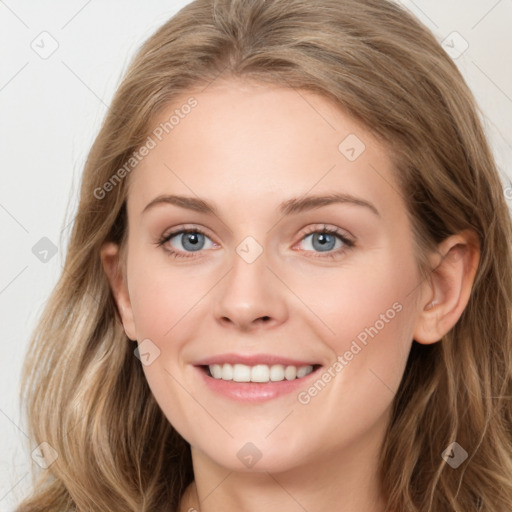 Joyful white young-adult female with long  brown hair and blue eyes