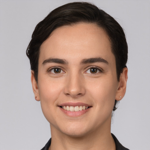 Joyful white young-adult female with short  brown hair and brown eyes