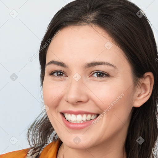 Joyful white young-adult female with medium  brown hair and brown eyes