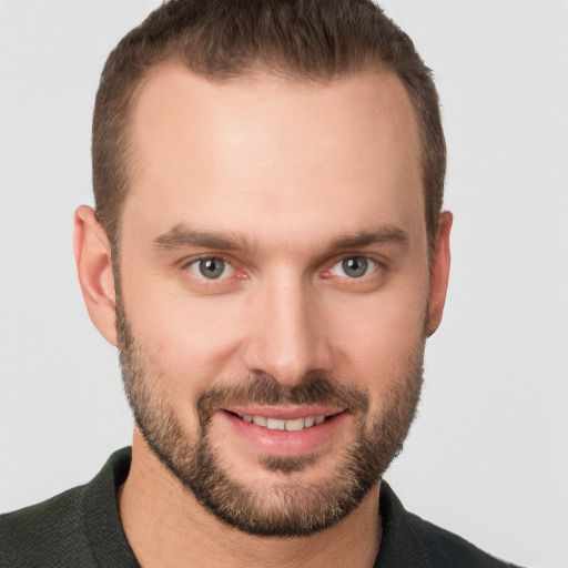 Joyful white young-adult male with short  brown hair and brown eyes