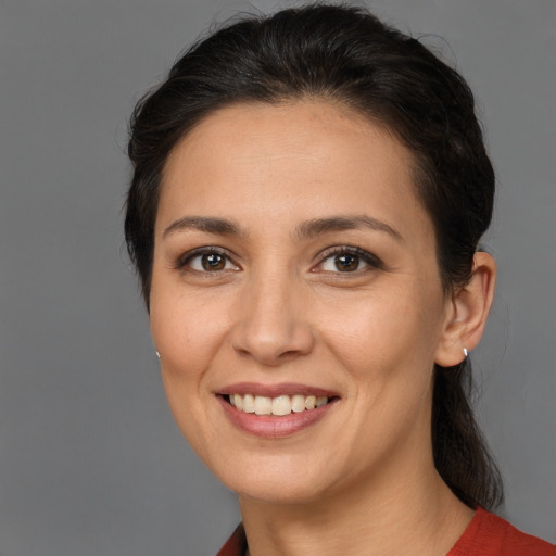 Joyful white young-adult female with medium  brown hair and brown eyes