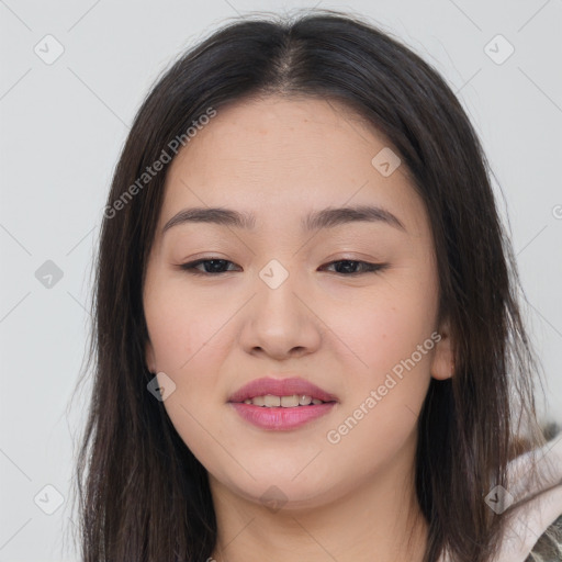 Joyful asian young-adult female with long  brown hair and brown eyes