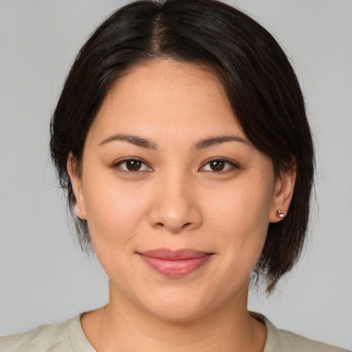 Joyful white young-adult female with medium  brown hair and brown eyes