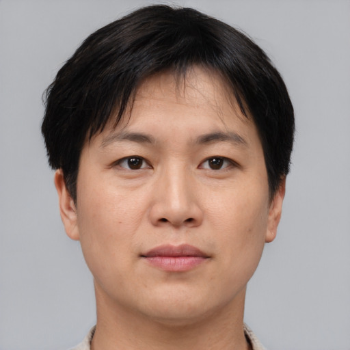 Neutral asian young-adult male with short  brown hair and brown eyes