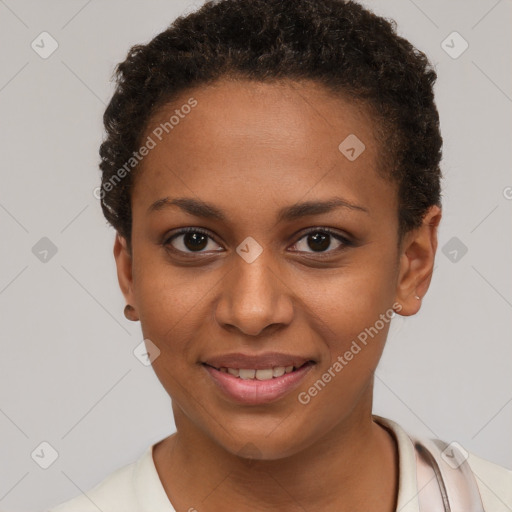 Joyful black young-adult female with short  brown hair and brown eyes