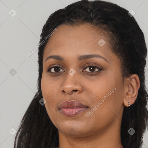 Joyful black young-adult female with long  black hair and brown eyes