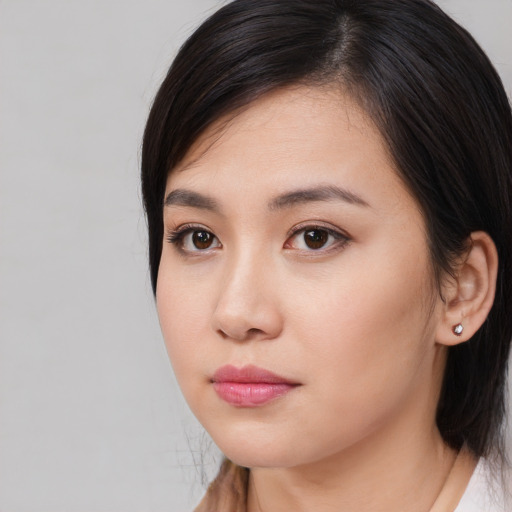Neutral asian young-adult female with medium  black hair and brown eyes