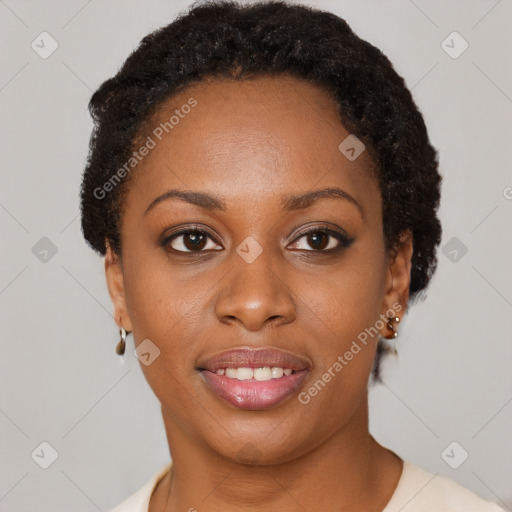 Joyful black young-adult female with short  brown hair and brown eyes