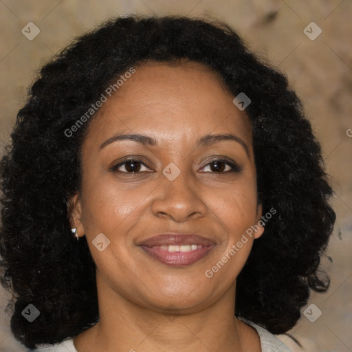 Joyful black adult female with medium  brown hair and brown eyes