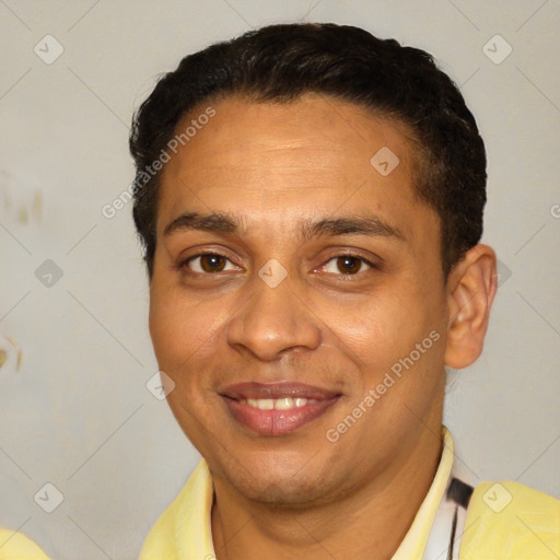 Joyful latino young-adult male with short  brown hair and brown eyes