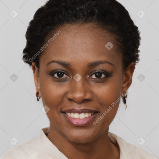 Joyful black young-adult female with short  black hair and brown eyes