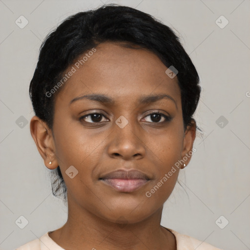 Joyful black young-adult female with short  black hair and brown eyes