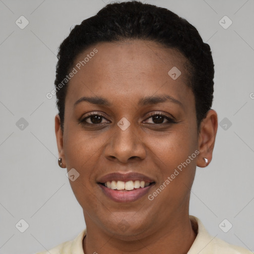 Joyful black young-adult female with short  black hair and brown eyes