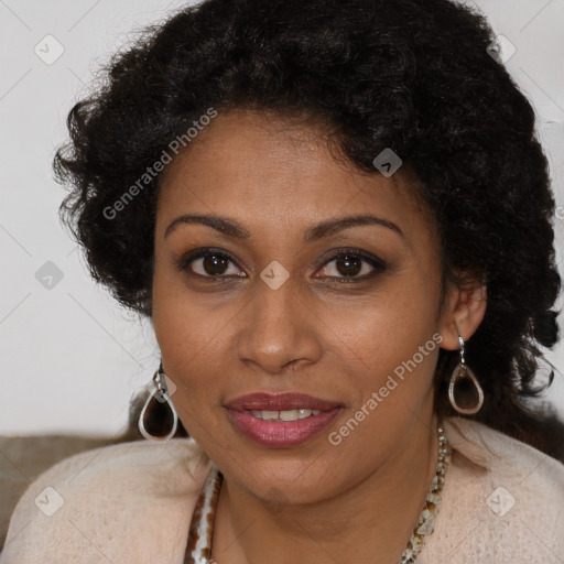 Joyful black young-adult female with long  brown hair and brown eyes