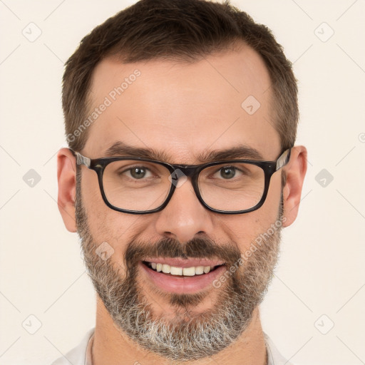 Joyful white adult male with short  brown hair and brown eyes